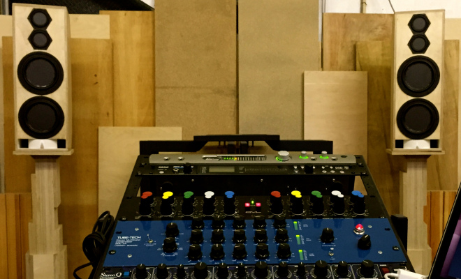 picture of audio mixing board and speakers